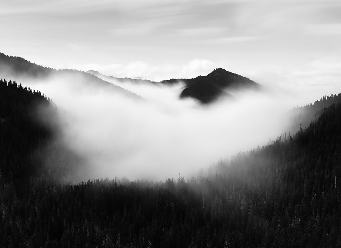 Mountain ridge rising above a sea of cloud