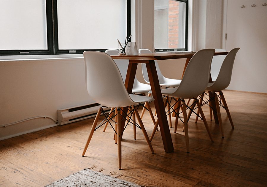 Bright meeting room with a wooden table and chairs