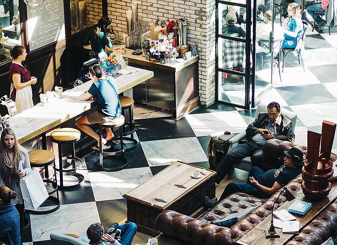 People working together in a busy shared workspace